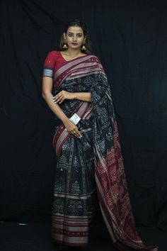 Finest pure handwoven sambalpuri ikat cotton saree with traditional motifs woven by the master weavers of Sambalpur, Odisha. It has lovely patterns and is world-famous for its gorgeous colours, texture and designs.  Specification                                                                                                                             Occasion       :- Casual Fabric               :- Sambalpuri Primary Color      :- Black Secondary Color  :-Maroon Material                :-Cotton Pattern               :- Motif Border Type   :-Ikkat Border Size       :-Medium Blouse Piece        :-Included Care               :- Dry Clean   Disclaimer : This is a genuine handwoven piece, It could expect unevenness in the selvedge and weave, and colours may fade or bleed due to the traditional Sambalpuri Saree Cotton, Navratri Black Cotton Silk Saree, Black Cotton Silk Saree For Navratri, Black Chanderi Traditional Wear With Block Print, Black Block Print Saree With Traditional Drape, Unstitched Black Saree With Block Print, Black Saree With Block Print And Traditional Drape, Black Traditional Wear With Block Print, Unstitched Black Block Print Traditional Wear