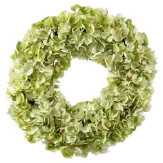 a green wreath with white flowers on it