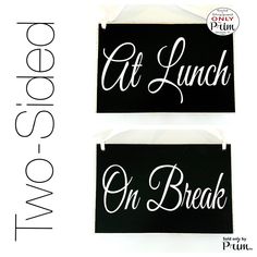 two black and white signs with the words eat lunch on break written in cursive font