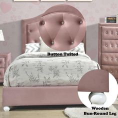 a pink bed with buttons on the headboard and foot board in front of it