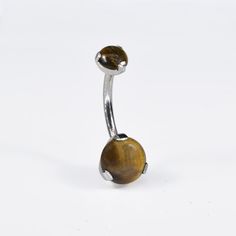 a metal object with a brown stone on it's end and a white background