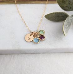 "Birthstone charm necklace includes one 3/8\" tiny heart charm, birthstones of your choice and chain. On the drop down menu you will have the option of selecting the chain length you would like. In the next box you will select the material (14k gold fill or sterling silver) and the birthstone quantity. \"No birthstones\" will include just the heart charm and chain, no birthstone. One birthstone will include heart charm, one crystal and chain, two charms will include two crystals...etc. ♥ For mor May Birthstone Charm Necklace For Mom With Round Pendant, May Birthstone Round Pendant Charm Necklace For Mom, May Birthstone Round Pendant Necklace For Mom, Birthstone Charm Necklace For Mom, Birthstone Pendant Charm Necklace For Mom, Personalized Birthstone Pendant Necklace For Everyday, Mother's Day Birthstone Pendant Charm Necklace, Dangle Birthstone Charm Necklaces For Gifts, Personalized Birthstone Charm Necklace With Heart Pendant