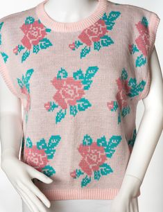 This is a lovely sweater by Eber International. The sweater is a light pink with dark pink roses surrounded by green leaves. The sweater is pull-over and sleeveless. Tina the Mannequin loves this sweater so much! It's super cute, soft and comfy. ANd the knit, those roses! That print! So cute. Tina thinks you will look smashing in this sweater! You should definitely get it! Tag: Eber International Size: L Materials: 100% Acrylic Stored in a smoke-free, pet-free environment Dark Pink Roses, Des Roses, Sleeveless Sweater, Dark Pink, Pink Roses, Sweater Outfits, Light Pink, Gender Neutral, Roses