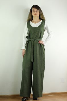 "Linen jumpsuit with belt and 2 pockets in green color, perfect for casual wear and suitable for any occasion in any season Details: - 100% natural linen produced in Europe ; - medium weight (180 gram per square meter); - color: green, could be any from our colors catalog (color samples at the photo); Made to order, approximately a few days, If you have any questions please message me and I will be glad to answer. Size guide : Size XS Bust: fits bust around 33\"-34\"/ 84-88 cm Waist: fits waist Green Linen Casual Jumpsuits And Rompers, Casual Green Linen Jumpsuits And Rompers, Green Belted Jumpsuits And Rompers For Work, Green Linen Jumpsuits And Rompers For Spring, Spring Green Linen Jumpsuits And Rompers, Linen Belted Jumpsuits And Rompers, Green Linen Jumpsuits And Rompers With Pockets, Casual Linen Belted Jumpsuits And Rompers, Linen Apron Pinafore