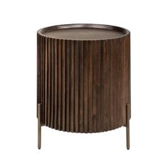 the side table is made from wood and has a metal base with an intricate design