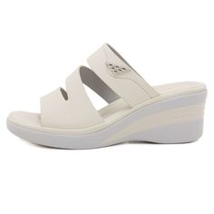 Upgrade your summer wardrobe with Siketu's Rica Cushioned Wedge Slides in Cream. These stylish and comfortable slides provide cushioned support with a trendy wedge design, making them the perfect addition to any outfit. Elevate your fashion and your comfort with these must-have slides. 2.36'' heel Slip-on PU upper Synthetic Arch support footbed™ Cushioned Insole™ Anti-skid rubber sole White Slides With Ortholite Insole For Summer, Comfortable Spring Wedge Sandals With Ortholite Insole, Spring Platform Slippers With Synthetic Material, Summer Wedge Sandals With Arch Support For Spring, Cushioned Wedge Sandals With Synthetic Material, Comfortable Cushioned Synthetic Wedge Sandals, Comfortable Cushioned Wedge Sandals, Summer Wedge Sandals With Ortholite Insole, Comfortable White Slip-on Wedge Sandals