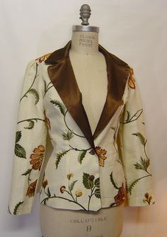 "Hand Made women's blazer with puffed sleeves, measurements are: Bust, 35; waist, 26; hip, 36; jacket length is 26\" long. Puff sleeve, 24\" long.  Hand made by the designer.  2 buttons in front, vintage bronze color metal buttons, one of a kind garment but I can make different sizes to order.  Lined inside without the sleeve. Dry clean only.  Outer fabric is linen cotton with machine embroidered flowers. Beautiful jacket. Lining is polysatin." Luxury Embroidered Long Sleeve Blazer, Luxury Floral Print Blazer For Workwear, Luxury Festive Blazer With Floral Embroidery, Luxury Fitted Blazer With Resham Embroidery, Luxury Long Sleeve Embroidered Blazer, Designer Luxury Embroidered Blazer, Luxury Floral Embroidered Blazer For Party, Luxury Designer Embroidered Blazer, Luxury Wedding Blazer With Intricate Embroidery