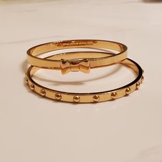 Two Kate Spade Bangle Bracelets, Never Worn. One Bow Bangle And One Dot Bangle. Both Gold. Kate Spade Formal Bracelet Jewelry, Kate Spade Formal Bracelet, Trendy Kate Spade Jewelry For Party, Trendy Kate Spade Party Jewelry, Formal Kate Spade Bracelet, Kate Spade Bangle Bracelet For Formal Occasions, Kate Spade Formal Bangle Bracelets, Kate Spade Formal Bangle Bracelet, Kate Spade Elegant Bangle Jewelry