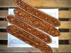 three wooden skis sitting on top of a table