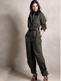 Ready for adventure, this utilitarian jumpsuit takes inspiration from archival styles with reinforced panels at the knees, topstitch detailing, pockets at the shins and a luxurious-yet-sturdy twill fabric of cotton, enhanced with a touch of stretch f Green Jumpsuit Outfit, Construction Outfit, Cargo Jumpsuit, Jumpsuit Outfits, Utility Jumpsuit, The Shins, Adventure Outfit, Jumpsuit Chic, Green Jumpsuit