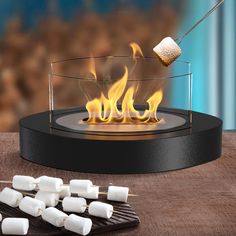 marshmallows are being cooked over an outdoor fire pit