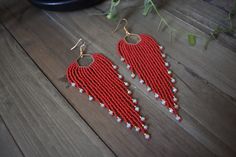 These gorgeous long red beaded earrings are made with high quality Japanese, Czech glass seed beads and Gold tone ear wire hooks. Other finishes are also available.  5" inches in length 1 1/4 " wide *All orders are shipped within 3-7 business days (after the order has been placed) by first class mail with a tracking information. If you need sooner please let me know. All custom orders will be shipped within 1-2 weeks. *All pieces are handmade and each piece is unique and should be handled with c Handmade Red Beaded Long Drop Earrings, Handmade Red Long Drop Beaded Earrings, Red Round Bead Earrings For Festivals, Red Long Drop Beaded Earrings As Gift, Red Long Drop Beaded Earrings For Gift, Elegant Red Beaded Earrings For Festival, Red Beaded Earrings For Festival, Red Long Drop Earrings With Dangling Beads, Red Long Drop Beaded Earrings