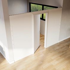 an open door leading into a room with wooden floors and white walls on the top floor