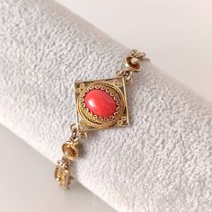 Vintage, 60s, Genoa, Italy. A beautiful bracelet made of gold-plated 800 silver filigree and with a Mediterranean red coral cabochon (corallium rubrum). it is an exceptional work of Italian jewelery from the 1960s, made in Genoa before 1968. The coral cabochons are 13.5 x 9.8 mm., without any color enhancement. The width of the central part is 25 mm, while the strap is between 6 and 7 mm. Length of the bracelet is 18 cm. (will be ideal for a wrist between 17 - 17.5 mm. ) It is very comfortable o Genoa Italy, Filigree Bracelet, Italian Jewelry, Genoa, Silver Filigree, Red Coral, Vintage 60s, Beautiful Bracelet, Bracelet Making