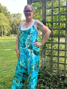 Custom tie dye jumper. Cotton, rayon blend. Jumper has adjustable straps and pockets.  Pictures are just examples of what I can do. All pieces are hand made and one of a kind.  Available in sizes small-3x Casual Green Jumpsuits And Rompers For Festival, Bohemian Blue Overalls For Summer, Casual Tie Dye Jumpsuits And Rompers For Summer, Sleeveless Tie Dye Jumpsuits And Rompers For Summer, Hippie Style Summer Festival Overalls, Bohemian Sleeveless Overalls For Summer, Casual Sleeveless Tie-dye Jumpsuits And Rompers, Casual Sleeveless Tie Dye Jumpsuits And Rompers, Spring Sleeveless Tie-dye Jumpsuits And Rompers