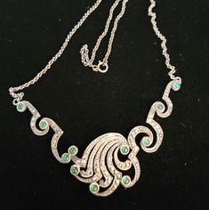 Is Beautiful Sterling Necklace Has Marcasite And Green Cabochon Stones. The Dainty Chain Is 18 In Plus The Front Section So Probably 22 To 24 In. Signed 925 On The Clasp. The Front Section Has An Interesting Design. Swirling Sections Undulate Down The Sides To Meet In A Cresting Wave. It Has A Deco Look, And Weighs 11 Grams. Ensure Of What The Green Stones Are Glass Or Stone. Sterling Necklace, Wave Necklace, Green Stones, Interesting Design, Sterling Necklaces, Dainty Chain, Green Stone, Vintage Art Deco, Womens Jewelry Necklace