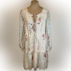 Nwt Elegant And Charming Boho Style Sheer Long Sleeve Dress. Gorgeous Lace Accents, Fringe Tie Front, Ruffled Hem And Lined Skirt. Perfect Country Or Casual Style! Ready To Wear! Colors: Cream, Pink, Blue Materials: 100% Polyester Measurements: Please See Photos Smoke Free White Feminine Boho Dress For Spring, White Bohemian Floral Dress For Garden Party, Feminine White Boho Dress For Spring, White Floral Print Boho Dress For Brunch, White Boho Dress With Floral Print For Brunch, White Floral Dress With Lace Trim For Spring, Bohemian Cream Mini Dress For Garden Party, White Boho Dress For Spring Garden Party, Sheer Long Sleeve Dress