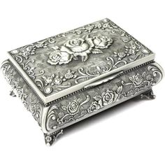 an ornate silver box with roses on it