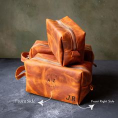 three pieces of luggage sitting on top of each other with the names j r and front side