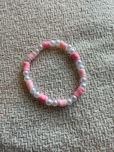 Handmade bracelet with pink clay beads and faux pearls Pink Clay Bracelet Ideas, Adjustable Pink Pearl Bracelet With Spacer Beads, Pink Beaded Pearl Bracelet With Round Beads, Pink Pearl Bracelet With Colorful Beads, Pink Beaded Pearl Bracelet, Handmade Pink Pearl Bracelet, Elegant Pink Beaded Bracelets For Beach, Pink Pearl Bracelet With Letter Beads, Pink Beaded Round Pearl Bracelet