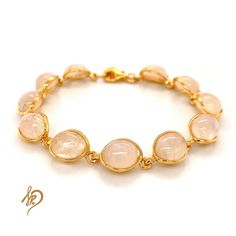 Effective Bracelet with Genuine Moonstone It is made of gold-plated 925 silver (Ag 925) We are plating our Goods with a thick layer of gold, therefore You can be satisfied with quality for ages. Standard length of this bracelet is around 18,5 cm, but there is a possibility to make it a little bit longer (up to 21 cm) because of the chain we put in the end. Bracelet is made of individual elements made of silver gold-plated and Moonstone. Cabochons measurements are 8x10 mm. Each of them may appear Gold Gemstone Crystal Bracelet, Gold Crystal Gemstone Bracelet, Gold Gemstone Jewelry With Rose Quartz, Gold Jewelry With Rose Quartz Gemstone, Rose Quartz Gemstone Gold Jewelry, Gold Rose Quartz Gemstone Jewelry, Yellow Gold Cabochon Bracelet As Gift, Elegant Gold Crystal Bracelet With Natural Stones, Dainty Round Moonstone Bracelets