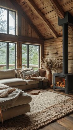 a living room filled with furniture and a wood burning stove in the middle of it