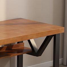 a wooden table with black metal legs and a shelf on the bottom that is open