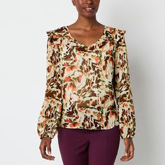 This Brannan women's v-neck blouse features a beautiful print, ruffled shoulder detail and long puffed sleeves for a feminine look and feel. Wear it with a pair of slacks to the office or with jeans and sandals for a casual day out. Closure Type: Pullover HeadFit: Regular FitNeckline: V NeckSleeve Length: Long SleeveApparel Length: 25 InchesFiber Content: 100% PolyesterFabric Description: WovenLining Material: PolyesterCare: Machine Wash, Line DryCountry of Origin: Imported Chic Multicolor Office Tops, Versatile Long Sleeve Top With Floral Print, Floral Print V-neck Top For Office, Elegant Multicolor Tops For Workwear, Chic Multicolor Blouse For Fall, Feminine V-neck Top For Fall, Multicolor Fall Office Tops, Versatile V-neck Blouse With Floral Print, Versatile V-neck Top With Floral Print