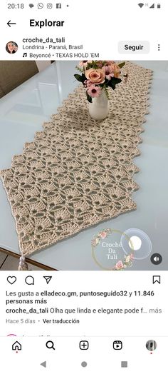 an image of a table runner made from crocheted cottons and yarn with flowers in a vase on top