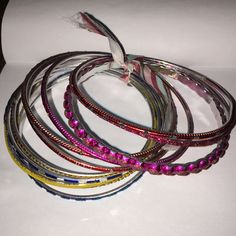 Rainbow Set Of Bracelets. Pink Red Blue And Yellow Shades. 11 Total. Bundle And Save 2/$7. Or 5/$15 Adjustable Purple Bangle For Festive Occasions, Purple Bangle Bracelets For Festivals, Purple Bracelets For Festivals And Gifts, Multicolor Metal Bracelets For Festivals, Festive Multicolor Metal Bracelets, Multicolor Stackable Metal Bracelets, Stackable Bracelets For Festivals, Blue Bracelets For Festivals, Adjustable Assorted Bracelets For Party