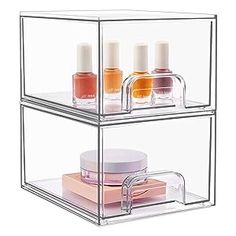 three tiered clear acrylic storage unit with nail polish and cosmetics in it