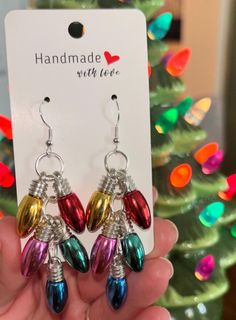 Handmade Christmas Dangle Earrings. Nothing screams Christmas festivities more than these adorable Christmas Lightbulb Earrings. They are so cute and lightweight. Excellent accessory to wear to all of your holiday parties and Christmas festivities! Christmas Light Bulb Earrings Diy, Cheap Multicolor Christmas Earrings, Bauble Bar Holiday Earrings, Holiday Jewelry Ideas, Earring Christmas, Christmas Festivities, Christmas Light Bulbs, Holiday Earrings, Earrings Christmas