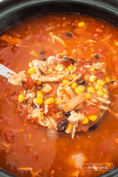 a crock pot filled with chicken tortilla soup