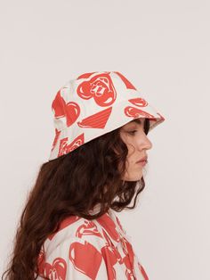 Despite appearances, I will never have the heart to tell you when you’ve got something stuck in your teeth. We love a bucket hat. This one is in our standard shape, with a nice wide brim and a red and white smiley heart design water printed on the hat, which is made from a thick and durable cotton twill. If you love the print, there’s also a matching shirt and shorts set available, as well as a pair of socks in the same design. Matching Shirt And Shorts, Heart Bucket Hat, Water Printing, Bowling Shirt, Lazy Oaf, Revere Collar, Boiler Suit, Women's Crocs, Summer Swim