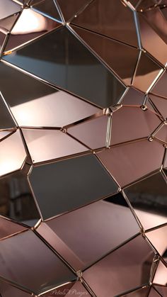 a close up view of some shiny mirrors