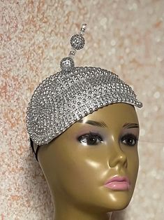 Looking for a head-turner? Look no further. This silver beaded piece fits the criteria. Silver beaded accented with Russina veil/netting, and hat pin. Perfect for church and any other special occasions: tea parties, weddings, etc. Length: 10 inches Width: 7 inches (inches from the widest part) The hat pin may vary and is for decorative purposes only and isn't for keeping the hat on the head. The hat is affixed to the head via a hatstring, NOT A HEADBAND. Handmade Gifts for mom, sister, wife, or yourself. Handmade Gifts For Mom, Bling Hat, Sister Wife, Hat Pin, Tea Parties, Hat Pins, Silver Beads, Fascinator, Veil