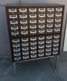 a large brown cabinet with many drawers