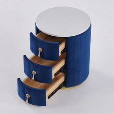 a blue and white table with three drawers on each side that has two keys in it