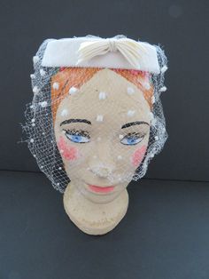 "Not too big and not too small, the perfect little head piece for church, social events or a wedding!! This vintage 'ring hat' is from the 1950's era. A wonderful white velvet ring hat with matching polka dot veil. The veil covers the entire hat and extends down around the face, sides and back (Note: The veil is torn in several places). There is a white gross grain bow in the front of the hat. The perfect little 'hat' that can be worn for several seasons. This little beauty was made to sit flat White Vintage Wedding Costume Hats And Headpieces, White Hat For Vintage Events, Vintage White Cloche Hat, Vintage White Cloche Fascinator, Vintage White Hat Headpiece, Polka Dot Veil, Hat With Veil, Velvet Hat, White Velvet