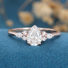 1-0-ct-pear-shaped-moissanite-cluster-engagement-ring-17 Pear Shaped Cluster Engagement Ring, Vintage Engagement Rings Pear Shaped, Almond Rings Engagement, Pear Moissanite Ring, Raindrop Ring Engagement, Pear Diamond With Side Stones, Rose Gold Engagement Ring Teardrop, Pearl Cut Engagement Ring, Pear Shaped Moissanite Engagement Ring