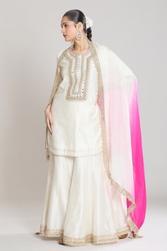 Ivory kurta with lace and mirror embroidery. Paired with a gharara and pink, ivory ombre dupatta and lace border. - Aza Fashions Off White Sharara With Zari Work And Straight Kurta, Festive Off White Palazzo Set With Sheer Dupatta, Festive Off-white Palazzo Set With Sheer Dupatta, White Palazzo Set With Gota Work For Eid, Eid White Palazzo Set With Gota Work, Festive White Palazzo Set With Gota Work, Off White Wedding Straight Kurta Set, White Chanderi Sharara With Straight Kurta, Off White Traditional Drape Sets With Gota Work