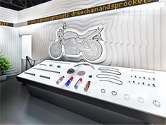 a display case with an image of a motorbike and other items on it