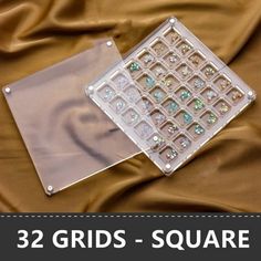 there is a piece of clear plastic with jewels on it and the text, 32 grids - square