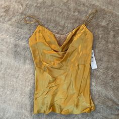 Never Worn. Needs A Steam But A Gorgeous Gold Color With Cream Lace Detail Spring Gold Silk Top, Gold Silk Top For Spring, Gold Silk Tops For Spring, Gold Silk V-neck Top, Gold Silk Top For Night Out, Gold Sleeveless Silk Top, Gold Silk Sleeveless Top, Yellow Sleeveless Silk Top, Gold Fitted Cami Top