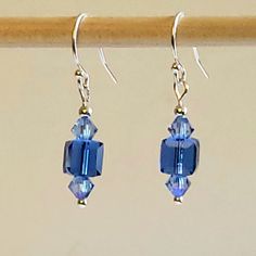 "- Stunning Swarovski Faceted Sapphire Blue Crystal Dangle Earrings in 6mm Cubes and 14mm Xilion Hearts AB. See Photos #1-4. - Crystal AB stands for Aurora Borealis referring to picking up colors around it. - 925 Sterling Silver 4mm Corrugated Beads and 3mm Pyramid Beads accent. - Nice swing to these 2 1/4\" Length Earrings. - 925 Sterling Silver Filled Bali Hook Ear Wires with Ball Ends. - 925 Sterling Silver Filled Leverbacks, Angular/Fish Hook Ear Wires or 925 Sterling Silver Posts/Studs with Blue Birthstone Earrings For Jewelry Making, Blue Birthstone Earrings For Crafting, Classic Blue Hypoallergenic Jewelry, Blue Crystal Earrings With Faceted Beads As Gift, Sterling Silver Blue Earrings With Faceted Beads, Blue Sterling Silver Earrings With Faceted Beads, Cube Earrings, Petite Earrings, Crystal Dangle Earrings