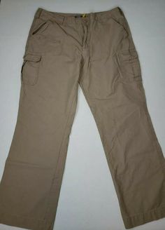 a pair of tan pants laying on top of a white surface