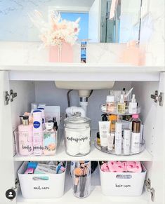 the bathroom cabinet is filled with beauty products