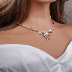 "Crystal with pearl bridal jewelry set: necklace, bracelet and earrings.  Gorgeous bridal or MOB jewelry set for your wedding day. Necklace measures about 17\" long.  Earrings are about 1\" long and 1/2\" wide. Matching regular bracelet is measuring: 7\" long and 1/4\" wide or an adjustable bolo matching bracelet is available as well. High quality guaranteed by GlamourBrideUSA! SHIPPING: Standard Shipping: 4-6 business days Priority mail Shipping: 2-3 business days *INTERNATIONAL ORDERS: PLEASE Silver Pearl Wedding Jewelry Sets, Wedding Crystal Jewelry Sets With Pearl Drop, Wedding Crystal Pearl Drop Jewelry Sets, Crystal Pearl Drop Jewelry Sets For Wedding, White Pearl Necklace With Elegant Design For Wedding, Pearl White Wedding Jewelry, Elegant Pearl Jewelry Sets For Wedding, Silver Pearl Drop Jewelry For Brides, Delicate Bridal Necklace With Elegant Design