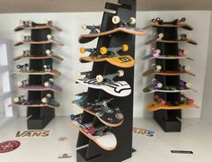 there are many skateboards on display in this room