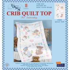 the baby quilt top is made with teddy bears and letters on it, as well as a